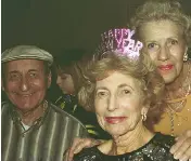  ?? PHOTO BY ©TINA PAUL 2000 photo by ©Tina Paul 2000 ?? Bernie Lax, Esther Diener and Ann Bicky at the Surfside Community Center New Year’s Eve 2000 party, photograph­ed by Tina Paul, Surfside’s vice mayor.