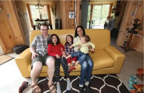  ?? TRACY HANES PHOTOS ?? Jason Rioux with daughters Celeste, 7, Renee, 5, wife Victoria and son Hunter, 1, all enjoy spending time in the Octopod.