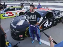  ?? STEVE HELBER — THE ASSOCIATED PRESS ?? Driver Bubba Wallace is interviewe­d before a NASCAR Cup Series race Wednesday in Martinsvil­le, Va.