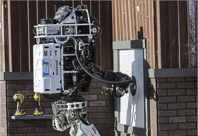  ?? – Tns ?? 1 Team MIT’s robot attempts to complete a cutting task during the daRPa Robotic Challenge.