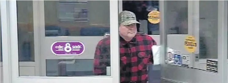  ?? FACEBOOK- MEDICINE HAT POLICE SERVICE / THE CANADIAN PRESS ?? A suspect is seen in a screengrab from the Medicine Hat Police Service Facebook page. An ex- CTV Winnipeg news director and sports anchor has been arrested on robbery charges.