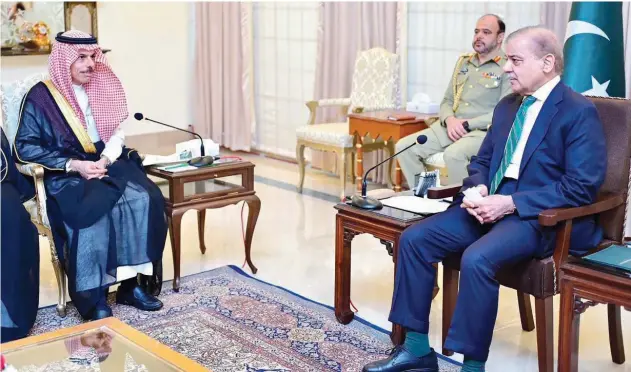  ?? Agence France-presse ?? ↑ Shahbaz Sharif (right) speaks with Faisal Bin Farhan during a bilateral meeting at the Prime Minister House in Islamabad on Tuesday.