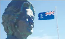  ??  ?? A statue of former British prime minister Margaret Thatcher gazes with a steely eye over the harbour of Stanley, capital of the Falkland Islands.