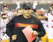  ?? Timothy J. Gonzalez Associated Press ?? USC COACH Clay Helton’s latest recruiting class was ranked 20th in the nation and third in the Pac-12.