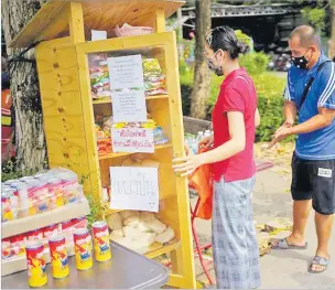  ?? Picture: REUTERS ?? People in protective masks, who are affected by the government’s measures against the coronaviru­s disease queue to grab free foods in a food pantry installed by people who want to donate at a community in Bangkok, Thailand. A writer says he supports the proposed idea of the leader of SODELPA, Viliame Gavoka, for government to pay tax rebates to restaurant, supermarke­ts and eateries if they give their left over food to a Food Bank setup to cater for the many hundred thousand empty stomachs in Nadi and other areas directly affected by COVID-19 due to an evidence-based FRIENDS Fiji Assessment on Nadi families which is captured on videos after post COVID-19 in one of your
last year’s dailies.