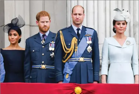 ??  ?? Harry and William stand together but the book claims William told his brother not to ‘rush’ with Meghan, while Kate is accused of snubbing her at a royal event