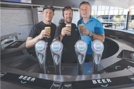  ?? Picture: MARK CRANITCH ?? THREE CHEERS: Mick Fanning, Balter founder Ant MacDonald and CUB CEO Peter Flipovic in Brisbane.