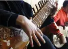  ?? Sadeq/AP ?? Rich history … a girl practises the sitar at the Afghanista­n National Institute of Music in Kabul in 2013. Photograph: Musadeq