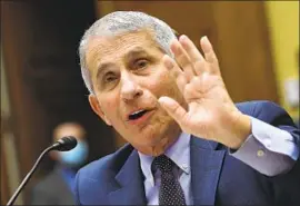  ?? Kevin Dietsch Associated Press ?? DR. ANTHONY FAUCI, honored Monday by the medical community for his “f irm leadership” amid the pandemic, has become a punching bag for Trump.