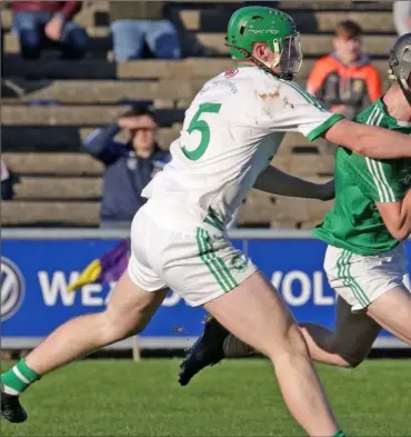  ??  ?? Naomh Eanna wing-forward Charlie McGuckin under pressure from Shamrocks defender Evan Shefflin.