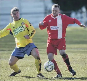  ??  ?? Ryhope Foresters (yellow) battle Hylton CW in the Over-40s League last week. Pictures by Tim Richardson.