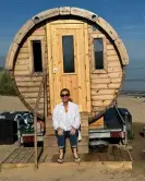  ?? Photograph: To Come ?? Emma O’Kelly, author of an upcoming guide about saunas in the UK, at Ty Sawna, Oxwich Bay, Gower.