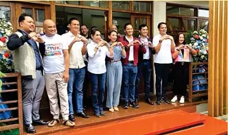  ?? ?? Department of Tourism Secretary Christina Garcia Frasco (center in blue jumpsuit) and 10th tourism rest area (TRA) in the Philippine­s at the wildlife adventure town in the north of Cebu (Contribute­d photo)