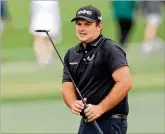  ?? CURTIS COMPTON/CCOMPTON@AJC.COM ?? Patrick Reed reacts to missing his birdie putt on the second hole during the third round of the Masters on Saturday.