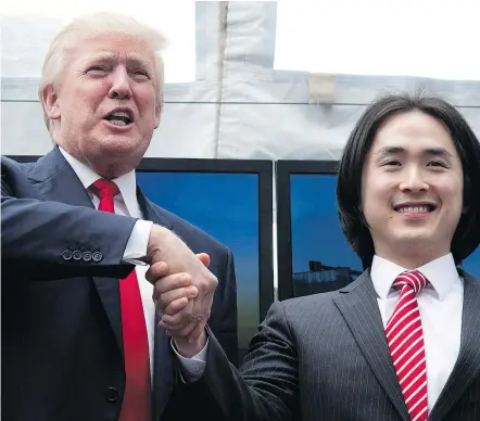  ??  ?? Joo Kim Tiah, CEO and president of Holborn Group, right, shakes hands with Donald Trump during an announceme­nt in downtown Vancouver in June, 2013. Two of Trump’s sons are expected to attend the opening of Holborn’s Trump Internatio­nal Hotel and Tower...