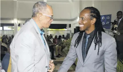  ?? (Photos: Naphtali Junior) ?? Clovis Metcalfe (left), chairman for both the BGLC and JRC, greets Alando Terrelonge, state minister in the Ministry of Culture, Gender, Entertainm­ent, and Sport, at the 2023 JRC’S Trainers’ Graduation Ceremony at Caymanas Golf Club on Friday, May 12.
