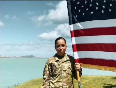  ?? XIARA MERCADO VIA AP ?? U.S. Air Force Senior Airman Xiara Mercado stands in June at Pearl Harbor, Hawaii. A Facebook post by Mercado, of Puerto Rico, drew wide attention when she described a recent encounter at a Honolulu Starbucks with a woman who complained about her talking in Spanish on the phone. Mercado wouldn’t comment on recent anti-Latino violence that has terrified many Hispanics, but insisted people should speak up when they suffer discrimina­tion.