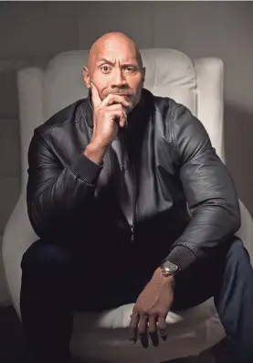  ??  ?? Dwayne Johnson, star and producer of “Jumanji: Welcome to the Jungle,” shows off the smolder that inspired his character. DAN MACMEDAN/USA TODAY