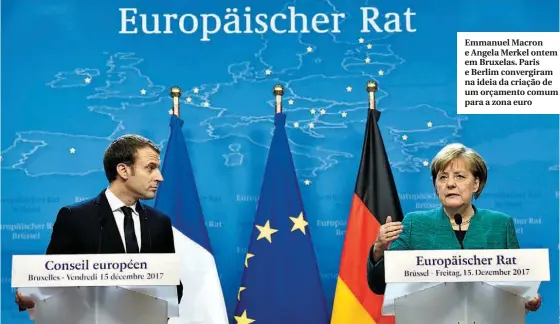  ??  ?? Emmanuel Macron e Angela Merkel ontem em Bruxelas. Paris e Berlim convergira­m na ideia da criação de um orçamento comum para a zona euro