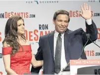  ?? PHELAN M. EBENHACK/AP ?? Florida Republican gubernator­ial candidate Ron DeSantis waves to supporters with his wife, Casey, at an election party Tuesday.