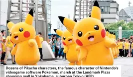  ??  ?? Dozens of Pikachu characters, the famous character of Nintendo's videogame software Pokemon, march at the Landmark Plaza shopping mall in Yokohama, suburban Tokyo (AFP)