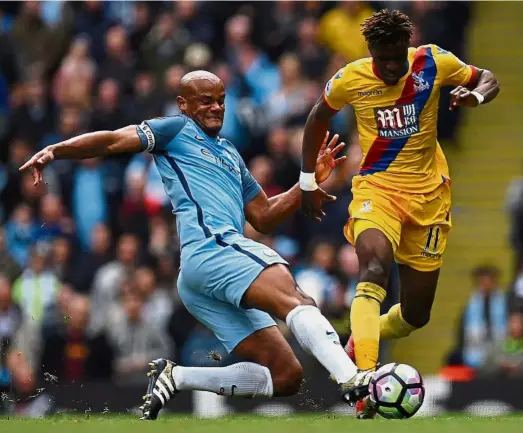  ??  ?? Make us proud: Manchester City will be counting on Vincent Kompany (left) to deliver the goods in the English Premier League match against Huddersfie­ld today. — AFP