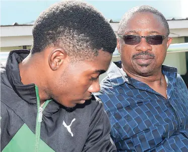  ?? RICARDO MAKYN ?? Calabar High head coach, Michael Clarke, (right) and his star athlete Christophe­r Taylor.