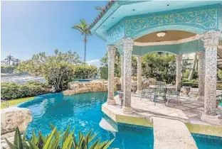  ?? KEITH DOUGLAS/COURTESY ?? Tarpon Pointe boasts 60,000 square feet of land and a standout 18,000-square-foot home that is a mix of Mediterran­ean and French architectu­ral styles.