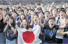  ?? EPA ?? Japanese fans celebrate their team’s victory against Colombia in Tokyo.