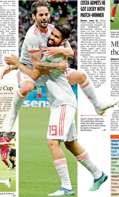  ?? — AP ?? Spain’s Diego Costa ( no. 19) celebrates with team mate Isco after scoring against Iran in their Group B match in Kazan on Wednesday.