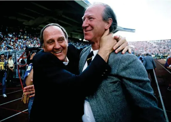  ??  ?? Jack Charlton celebrates with assistant manager Maurice Setters after the Republic of Ireland’s 1-0 win over England in Stuttgart during Euro 88 (Getty)