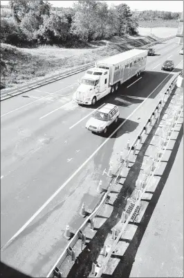  ?? DAVID Gard/associated Press ?? traffic moves past an accident scene on the New Jersey turnpike on June 7 near Cranbury, N. J. A crash at the site killed one person, and injured comedian tracy Morgan and three others.