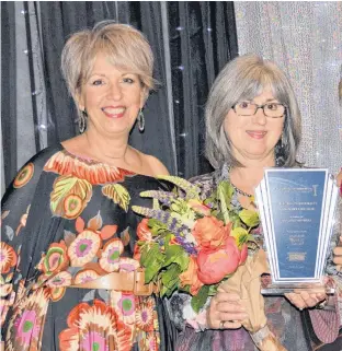  ??  ?? In 2019, Annapolis Valley Chamber of Commerce 2nd vice president Sue Hayes presented the inaugural Women of Excellence Community Leader for Betterment Award to AIRO founder and CEO Jane Nicholson.