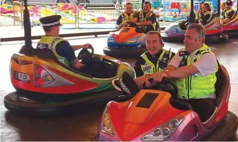  ??  ?? The dodgem squad: Chief Supt Darren Downs, right, leads the merriment