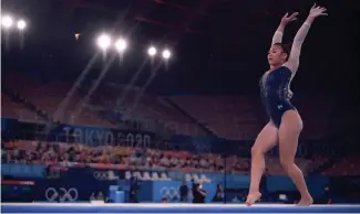  ?? MARTIN BUREAU /AFP VIA GETTY IMAGES ?? Suni Lee competes in the floor event of the women's all-around final during the Summer Olympics at the Ariake Gymnastics Centre in Tokyo on Thursday.