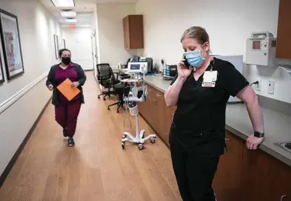  ?? Photos by Brett Coomer / Staff photograph­er ?? “We still can’t figure out exactly what it is,” Tammy McCrumb, a nurse manager at a post-COVID clinic, says of brain fog symptoms.