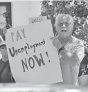  ?? CHRIS O'MEARA/AP ?? “We understand that many desperate workers see reopening the state as their only option to survive, but for many people in our communitie­s, ‘reopening’ is a myth at best or a deadly risk at worst,” write the op-ed authors.