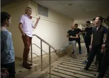  ?? ALEXANDER ZEMLIANICH­ENKO — THE ASSOCIATED PRESS ?? Vaziev talks with dancers at the Bolshoi Theater backstage in Moscow last month.