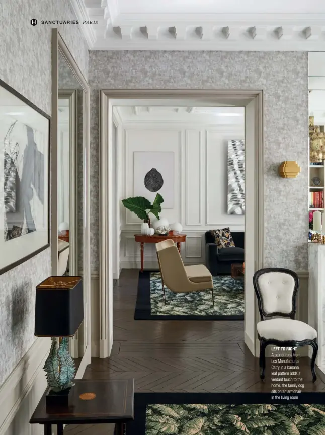  ??  ?? LEFT TO RIGHT
A pair of rugs from Les Manufactur­es Catry in a banana leaf pattern adds a verdant touch to the home; the family dog sits on an armchair in the living room