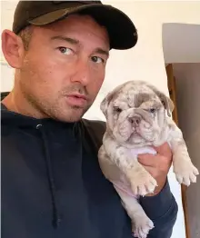  ?? ?? Posing: Karl Shellard, 43, with one of the puppies
