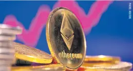  ?? ?? A representa­tion of the virtual currency Ethereum is seen in front of a stock chart.