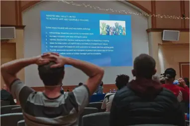  ?? Photos by Michaela Vatcheva/Special to The Chronicle ?? Celimene Pastor presents an analysis of police stop data at the Mill Valley City Council meeting on Oct. 3. The report revealed residents call the police on Black people at roughly 20 times the rate they do for whites.