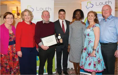  ??  ?? Below: Gerry Murphy Met Éireann presents Fleadh Cheoil Volunteers 2018, winners of the Louth PPN Community &amp; Voluntary Awards 2018 Voluntary Team of the Year.