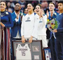  ?? SEAN D. ELLIOT/THE DAY ?? UConn senior Kia Nurse, back, cheers as fellow Gabby Williams, front, is honored with a spot on the Huskies Wall of Honor during Senior Night festivitie­s prior to Monday night’s 82-53 win over South Florida.