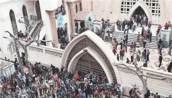  ?? NARIMAN EL-MOFTY, AP ?? Crowds gather after a church bombing Sunday in the Nile Delta town of Tanta, Egypt.