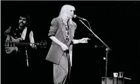  ?? Photograph: Steve Rapport/Getty Images ?? ‘Mitchell refashione­d her artistic compass towards the future’ … the singer performing at Wembley Arena in 1983.