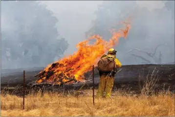  ?? UKIAH DAILY JOURNAL ?? The River Fire breaks out in a section of dried grass along Old River Road between Ukiah and Hopland in 2018.