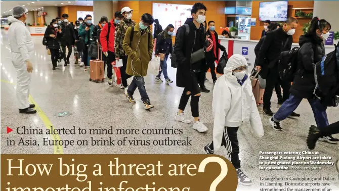  ?? Photo: cnsphoto ?? Passengers entering China at Shanghai Pudong Airport are taken to a designated place on Wednesday for quarantine.