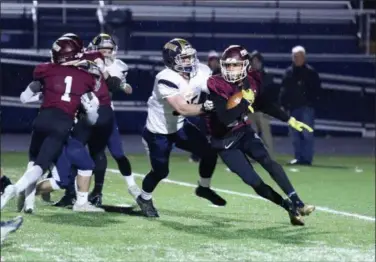  ?? DAVID SCHNEIDER — FOR THE MORNING JOURNAL ?? Rocky River’s Cristain Dean runs as Norwalk’s Tche Leroux pursues him during the first quarter of a Division III, Region 10 semifinal on Nov. 9.