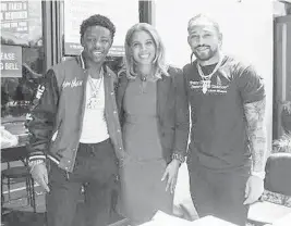  ?? ALBERTWILS­ON FOUNDATION ?? Recording artist Jackboy, Eagles Nest Principal Christine Mentis and Miami Dolphins player AlbertWils­on at Eagles Nest Middle School in Lauderhill during a school lunch and food voucher drive.